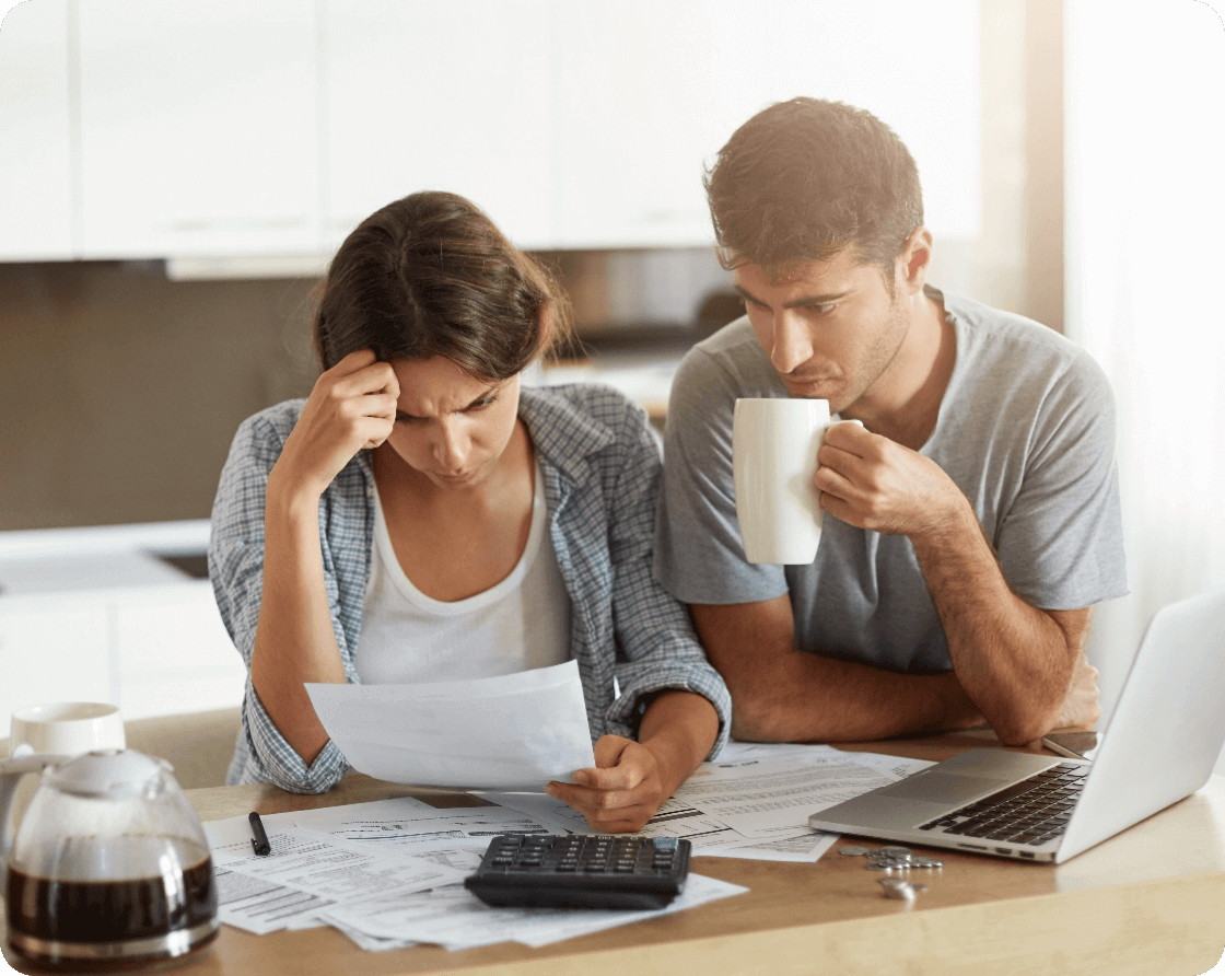 young-couple-checking-their-family-budget@2x (1)